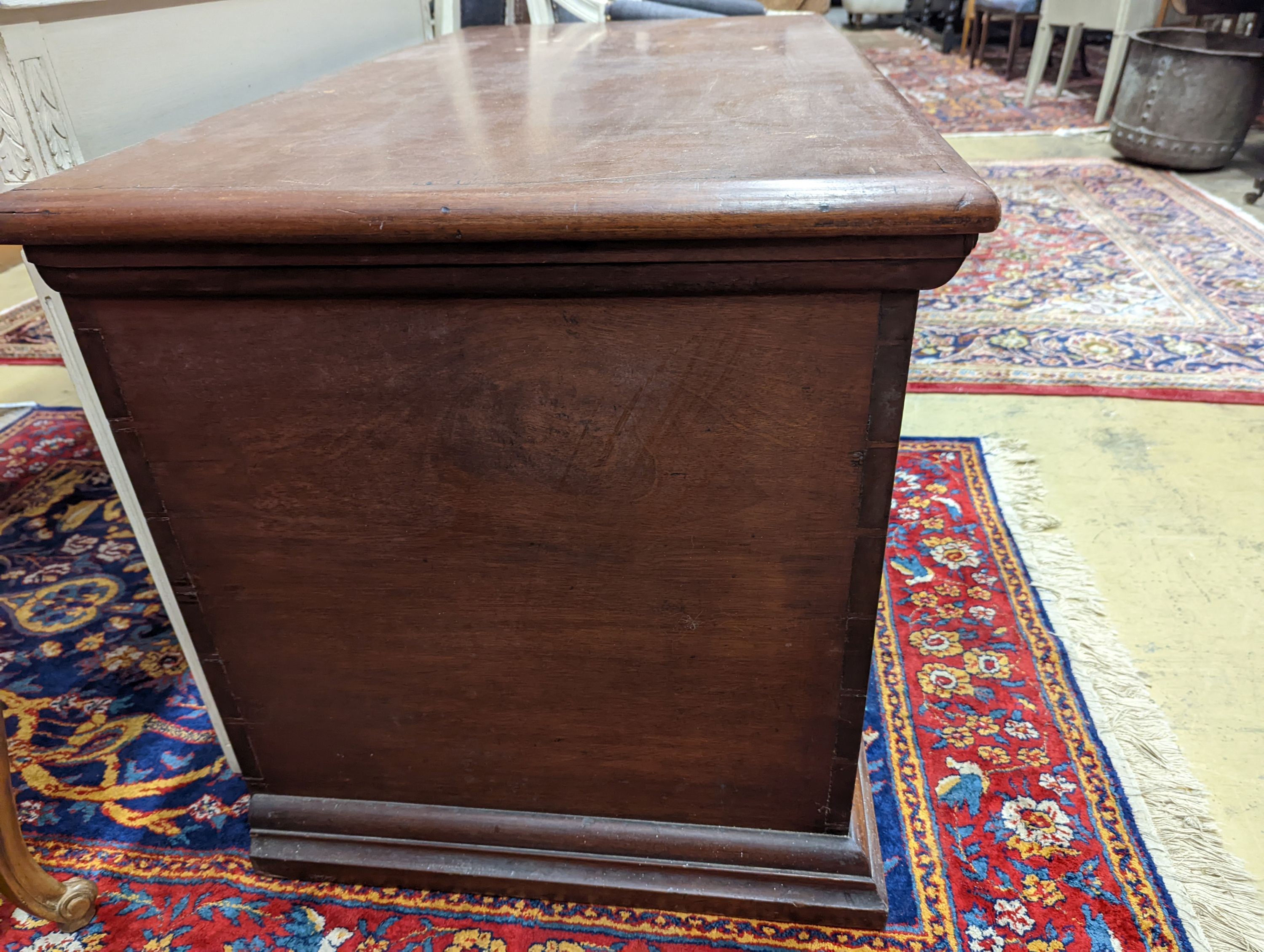 A large rectangular carved teak trunk, length 116cm, depth 58cm, height 64cm